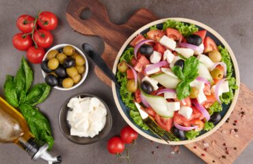 classic-greek-salad-fresh-vegetables-cucumber-tomato-sweet-pepper-lettuce-red-onion-feta-cheese-olives-with-olive-oil-healthy-food-top-view (1)-min